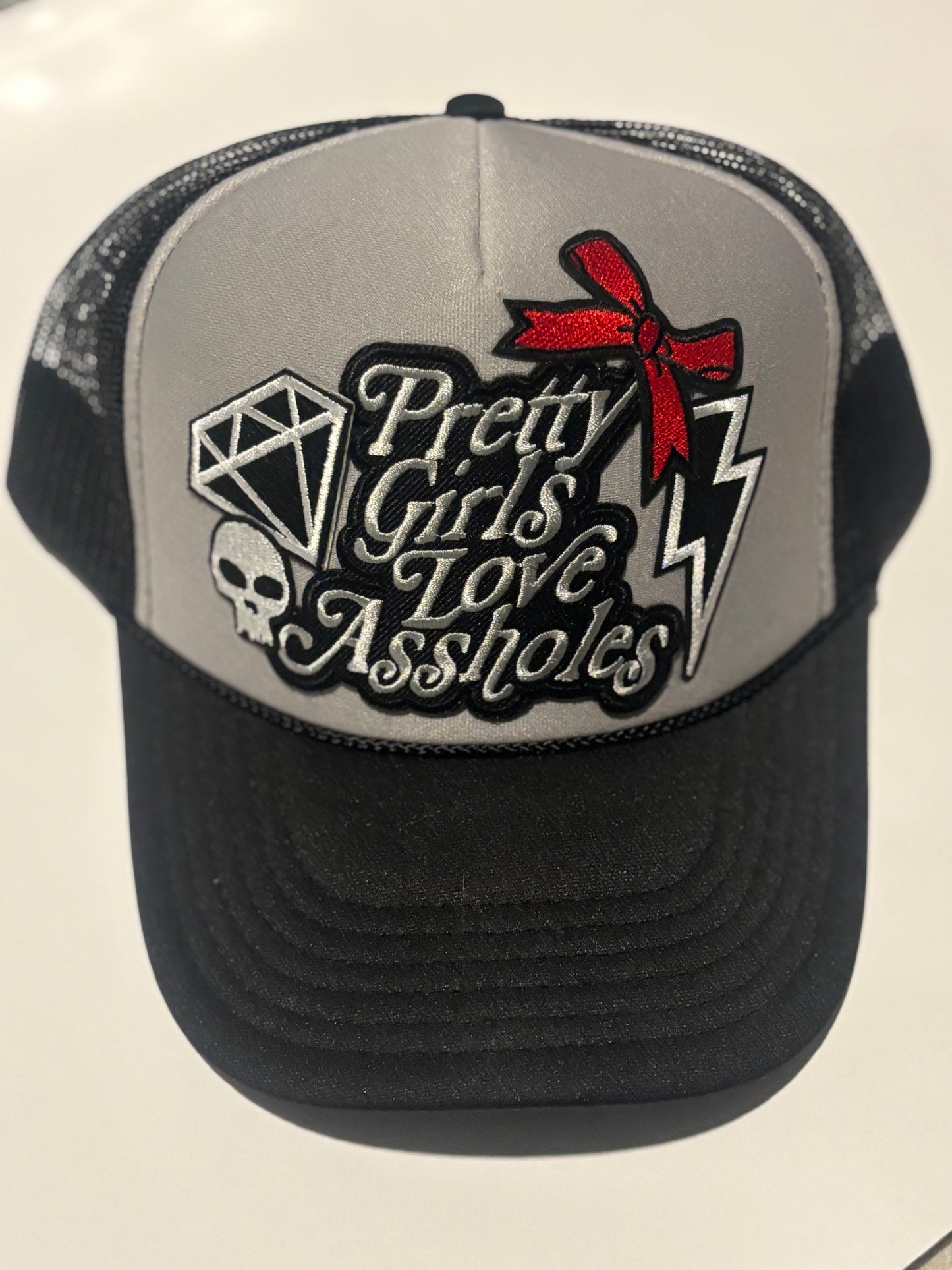 PRETTY GIRLS LOVE ASSHOLES